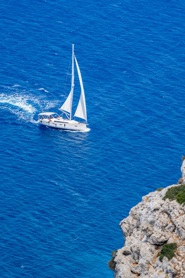 Yacht sailing on rippling sea